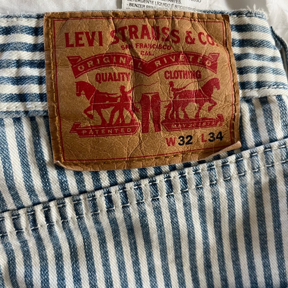 Levi like new jeans. Mens size 32x34 blue and white striped.